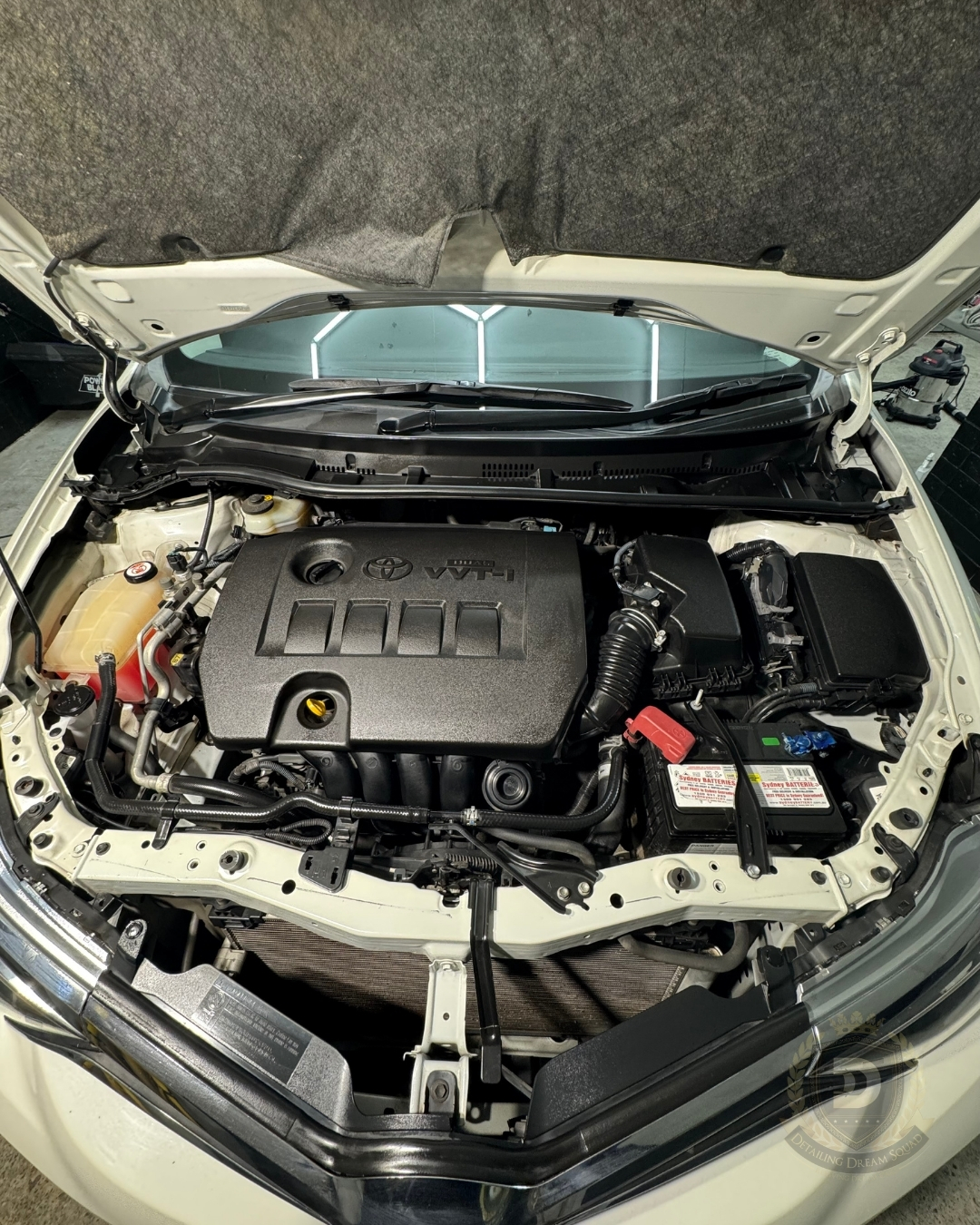 Spotless Toyota VVT-i engine bay after professional steam cleaning and detailing by Detailing Dream Squad.